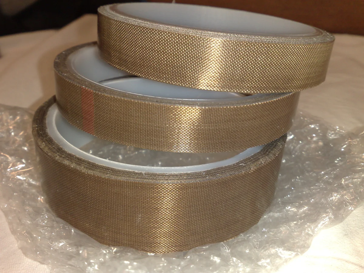 Industrial PTFE coated fiberglass adhesive tape rolls with pressure-sensitive silicone adhesive